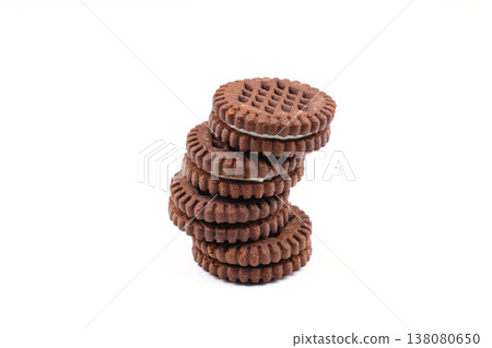 Round chocolate sandwich cookie with white cream filling isolated on white background Round chocolate sandwich cookie with white cream filling isolated on white background 138080650