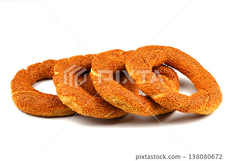 Turkish traditional bagel / simit with sesame on white background, turkish breakfast pastry concept Turkish traditional bagel / simit with sesame on white background, turkish breakfast pastry concept 138080672