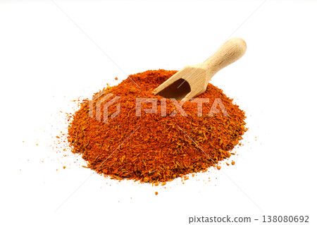 Cajun seasoning pile with wooden scoop isolated on white background 138080692