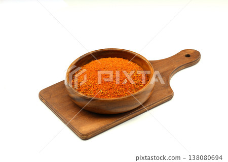 Cajun seasoning in a wooden bowl isolated on white background Cajun seasoning in a wooden bowl isolated on white background 138080694
