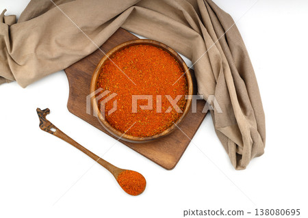 Cajun seasoning in a wooden bowl isolated on white background Cajun seasoning in a wooden bowl isolated on white background 138080695