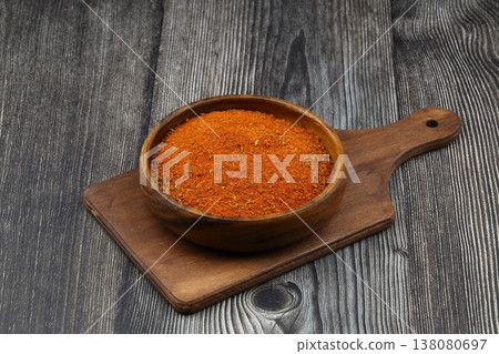 Cajun seasoning in a bowl on a dark wooden background 138080697