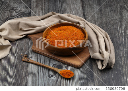 Cajun seasoning in a bowl on a dark wooden background 138080706