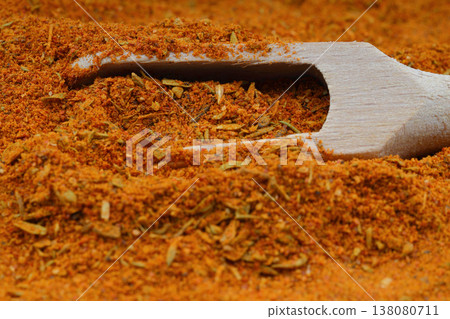 Full frame of Cajun seasoning texture with wooden scoop Full frame of Cajun seasoning texture with wooden scoop 138080711