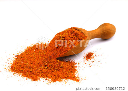 Cajun seasoning in a wooden scoop and scattered pile isolated on white background Cajun seasoning in a wooden scoop and scattered pile isolated on white background 138080712