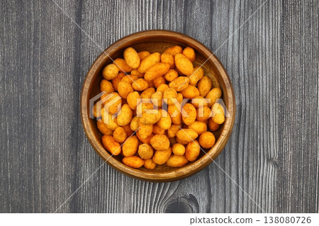 Crunchy Coated Peanuts in a Wooden Bowl on Wooden Background 138080726