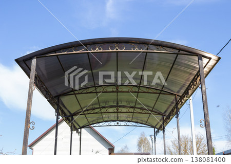 Outdoor gazebo canopy with curved polycarbonate roofing and decorative wrought iron metal framework Outdoor gazebo canopy with curved polycarbonate roofing and decorative wrought iron metal framework 138081400