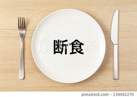 A plate and cutlery with the word "fasting" written on it. A plate and cutlery with the word "fasting" written on it. 138082270