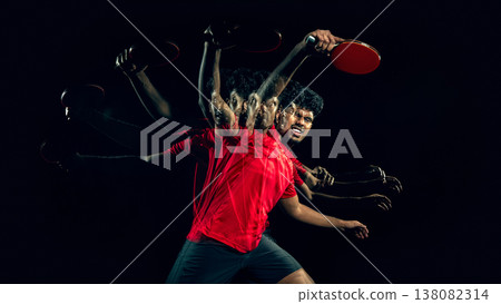 Table tennis player in extended motion sequence in dark studio with large empty space Table tennis player in extended motion sequence in dark studio with large empty space 138082314