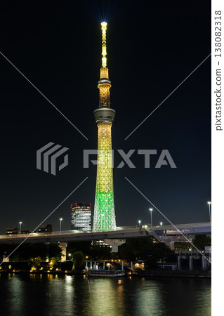 Night view of Tokyo Skytree, with beautiful reflections of the majestic tower in the Sumida River, it's the primary television and radio broadcast site in the Kanto region, Japan. Night view of Tokyo Skytree, with beautiful reflections of the majestic tower in the Sumida River, it's the primary television and radio broadcast site in the Kanto region, Japan. 138082318
