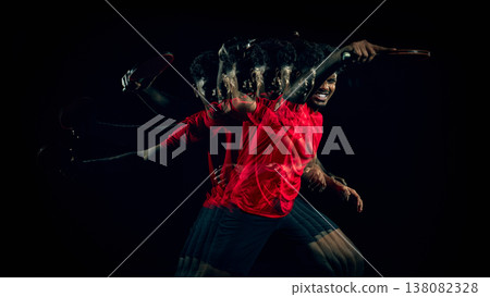 Table tennis player with stroboscopic motion in wide dark studio composition with copy space. Table tennis player with stroboscopic motion in wide dark studio composition with copy space. 138082328