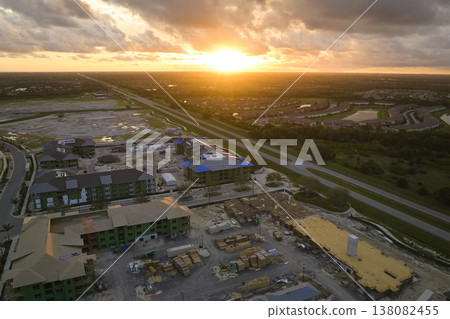 Top view of apartment buildings under construction in new developing suburban area. Development of residential housing in american suburbs. Real estate market in the USA Top view of apartment buildings under construction in new developing suburban area. Development of residential housing in american suburbs. Real estate market in the USA 138082455