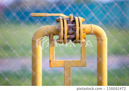 The gas valve on the yellow metal tube. Blocking damper on gas pipe. 138082472