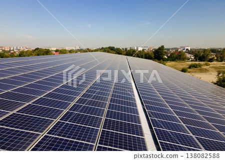 Solar photovoltaic panels installed on building roof for producing clean ecological electric energy. Renewable electricity with zero emission concept 138082588