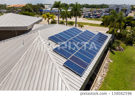 Solar panels on residential house rooftop. Photovoltaic sells for producing of clean electrical energy in suburban rural area. Concept of investment in autonomous home 138082596