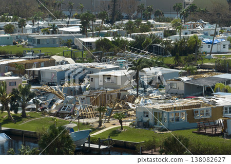 Severely damaged houses after hurricane Ian in Florida mobile home residential area. Consequences of natural disaster Severely damaged houses after hurricane Ian in Florida mobile home residential area. Consequences of natural disaster 138082627