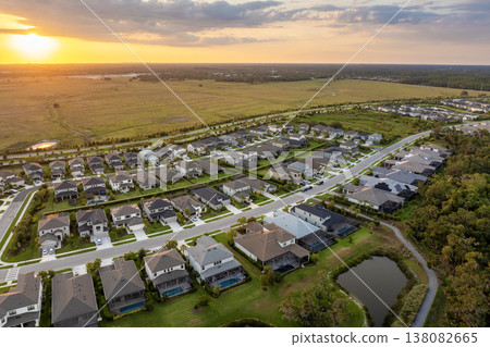 Rich neighborhood with expensive residential homes in southwest Florida. Wealthy suburban area Rich neighborhood with expensive residential homes in southwest Florida. Wealthy suburban area 138082665