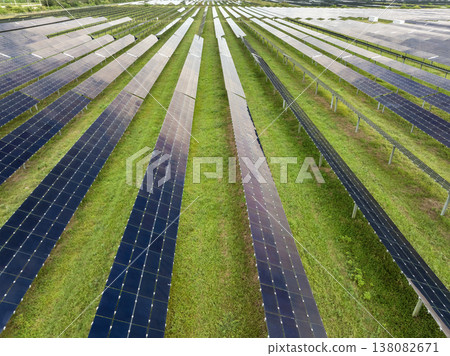 Renewable electricity with zero emission. Sustainable electric power plant with many rows of solar photovoltaic panels for producing clean electrical energy 138082671