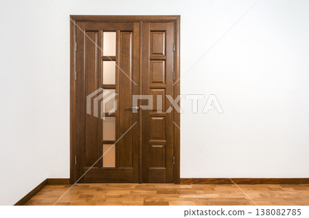 New brown wooden door in house interior New brown wooden door in house interior 138082785