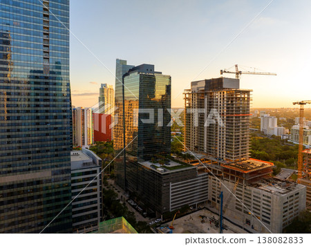 Miami, Florida. New construction site of developing residence in American urban area at sunset. Concept of housing growth in the USA Miami, Florida. New construction site of developing residence in American urban area at sunset. Concept of housing growth in the USA 138082833