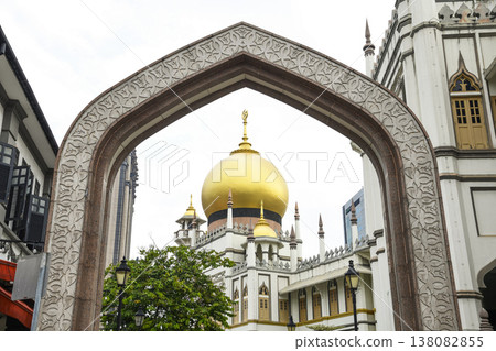 Building view of the Sultan Mosque and beautiful granite arches at Muscat Street in Kampong Glam, Singapore. Building view of the Sultan Mosque and beautiful granite arches at Muscat Street in Kampong Glam, Singapore. 138082855