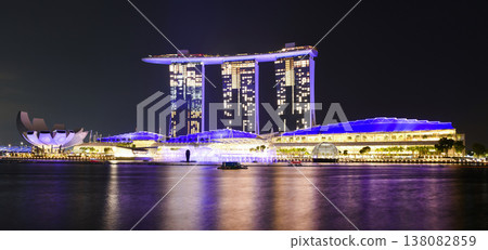 Night view of the Marina Bay Sands. This integrated resort fronts Marina Bay in Singapore. At night, there is an exhilarating music, light, and water dance show. Night view of the Marina Bay Sands. This integrated resort fronts Marina Bay in Singapore. At night, there is an exhilarating music, light, and water dance show. 138082859