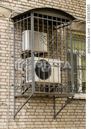 air conditioning on facade of building, air cooling in hot weather.  138083005