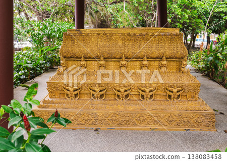 Detailed golden carved Buddhist structure with traditional patterns in tropical temple garden Koh Samui Thailand 138083458