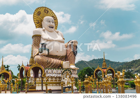 Giant laughing buddha statue at plai laem temple koh samui thailand with ornate golden architecture and tropical landscape 138083496