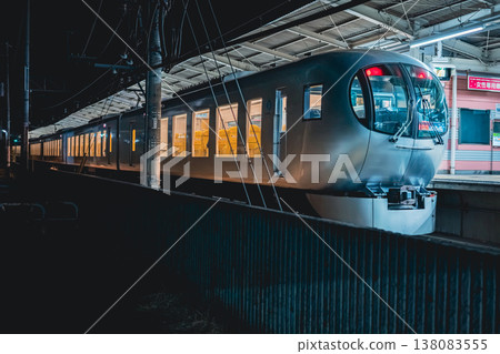 Iruma City Station at night and the Limited Express Laview 138083555
