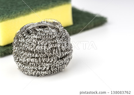 Stainless Steel Wire Wool Scrubber Ball and Yellow Green Kitchen Sponge Cleaning Pad Isolated on Clean White Background for Household Dishwashing Use 138083762