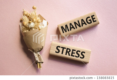 Manage stress symbol. Concept word Manage stress on wooden blocks. Beautiful pink background with bouquet of flowers. Business and Manage stress concept. Copy space Manage stress symbol. Concept word Manage stress on wooden blocks. Beautiful pink background with bouquet of flowers. Business and Manage stress concept. Copy space 138083815