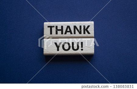 Thank you symbol. Wooden blocks with words Thank you. Beautiful deep blue background. Business and Thank you concept. Copy space. 138083831