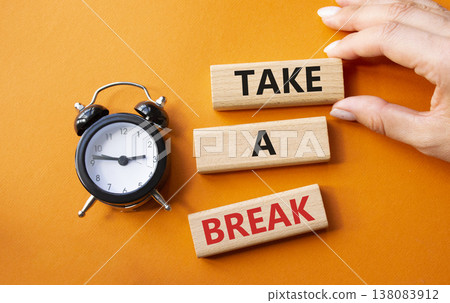 Take a break symbol. Concept words Take a break on wooden blocks. Businessman hand. Beautiful orange background with alarm clock. Business and Take a break concept. Copy space. Take a break symbol. Concept words Take a break on wooden blocks. Businessman hand. Beautiful orange background with alarm clock. Business and Take a break concept. Copy space. 138083912