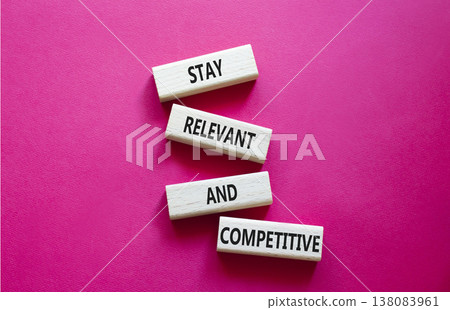 Relevant and Competitive symbol. Concept words Stay Relevant and Competitive on wooden blocks. Beautiful bright red background. Business and Stay Relevant and Competitive concept. Copy space. Relevant and Competitive symbol. Concept words Stay Relevant and Competitive on wooden blocks. Beautiful bright red background. Business and Stay Relevant and Competitive concept. Copy space. 138083961