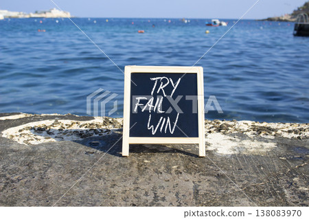 Try Fail Win symbol. Blackboard with words Try Fail Win. Beautiful sea background. Business and Try Fail Win concept. Copy space. Try Fail Win symbol. Blackboard with words Try Fail Win. Beautiful sea background. Business and Try Fail Win concept. Copy space. 138083970