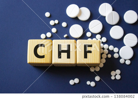 CHF symbol. Wooden cubes with words CHF Congestive Heart Failure. Beautiful deep blue background. Healthcare and Congestive Heart Failure concept. Copy space. CHF symbol. Wooden cubes with words CHF Congestive Heart Failure. Beautiful deep blue background. Healthcare and Congestive Heart Failure concept. Copy space. 138084002