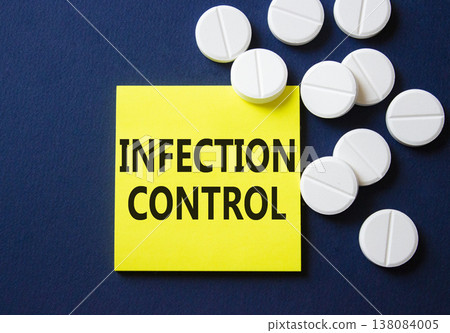 Infection Control symbol. Concept word Infection Control on yellow note. Beautiful deep blue background with pills. Medicine and Infection Control concept. Copy space Infection Control symbol. Concept word Infection Control on yellow note. Beautiful deep blue background with pills. Medicine and Infection Control concept. Copy space 138084005