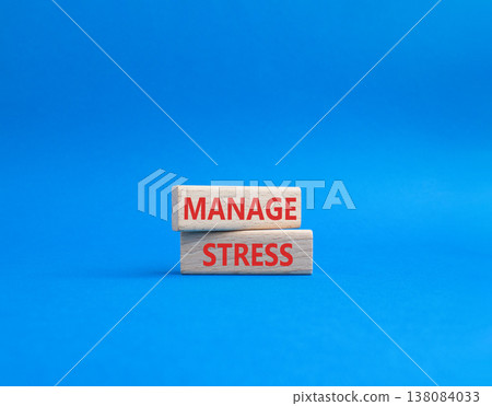 Manage stress symbol. Concept word Manage stress on wooden blocks. Beautiful blue background. Business and Manage stress concept. Copy space Manage stress symbol. Concept word Manage stress on wooden blocks. Beautiful blue background. Business and Manage stress concept. Copy space 138084033