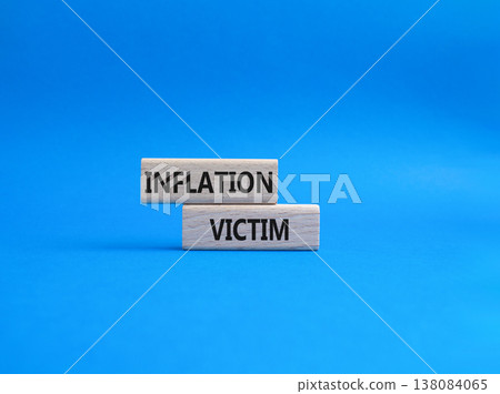Inflation Victim symbol. Wooden blocks with words Inflation Victim. Beautiful blue background. Business and Inflation Victim concept. Copy space. Inflation Victim symbol. Wooden blocks with words Inflation Victim. Beautiful blue background. Business and Inflation Victim concept. Copy space. 138084065