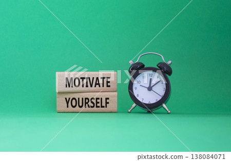 Motivation symbol. Concept words Motivate yourself on wooden blocks. Beautiful green background with alarm clock. Business and Motivate yourself concept. Copy space. Motivation symbol. Concept words Motivate yourself on wooden blocks. Beautiful green background with alarm clock. Business and Motivate yourself concept. Copy space. 138084071