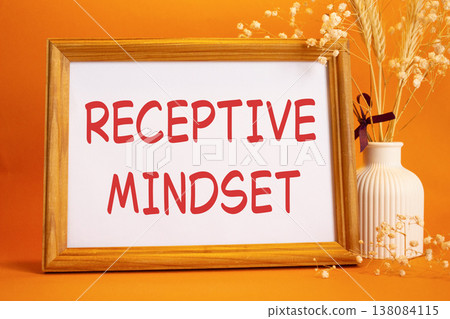 Receptive Mindset symbol. Concept words Receptive Mindset on beautiful wooden picture frame. Beautiful orange background with flower vase. Business and Receptive Mindset concept. Copy space. 138084115