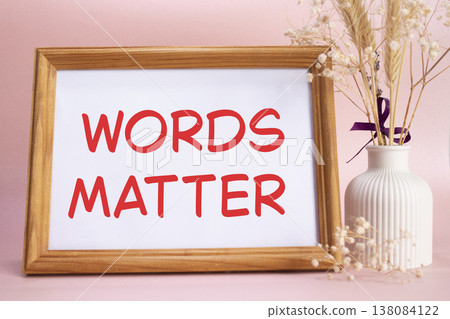 Words Matter symbol. Concept words Words Matter on beautiful wooden picture frame. Beautiful pink background with flower vase. Business and Words Matter concept. Copy space. Words Matter symbol. Concept words Words Matter on beautiful wooden picture frame. Beautiful pink background with flower vase. Business and Words Matter concept. Copy space. 138084122