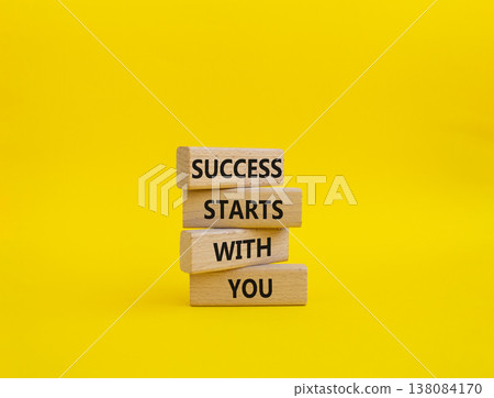 Success symbol. Wooden blocks with words Success Starts With You. Beautiful yellow background. Business and Success concept. Copy space Success symbol. Wooden blocks with words Success Starts With You. Beautiful yellow background. Business and Success concept. Copy space 138084170