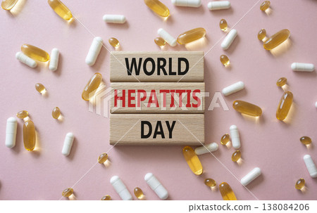 World Hepatitis Day symbol. Concept words World Hepatitis Day on wooden blocks. Beautiful pink background with pills. Healthcare and World Hepatitis Day concept. Copy space. World Hepatitis Day symbol. Concept words World Hepatitis Day on wooden blocks. Beautiful pink background with pills. Healthcare and World Hepatitis Day concept. Copy space. 138084206