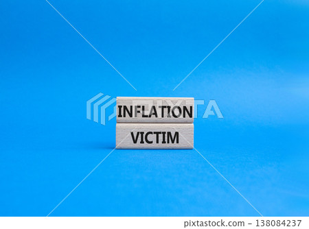 Inflation Victim symbol. Wooden blocks with words Inflation Victim. Beautiful blue background. Business and Inflation Victim concept. Copy space. Inflation Victim symbol. Wooden blocks with words Inflation Victim. Beautiful blue background. Business and Inflation Victim concept. Copy space. 138084237