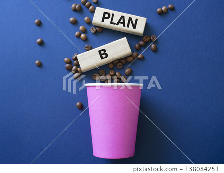 Plan B symbol. Wooden blocks with words Plan B. Beautiful deep blue background with coffee cup and coffee beans. Business and Plan B concept. Copy space. 138084251