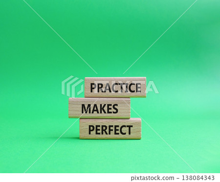 Practice Makes Perfect symbol. Wooden blocks with words Practice Makes Perfect. Beautiful green background. Business and Practice Makes Perfect concept. Copy space. 138084343