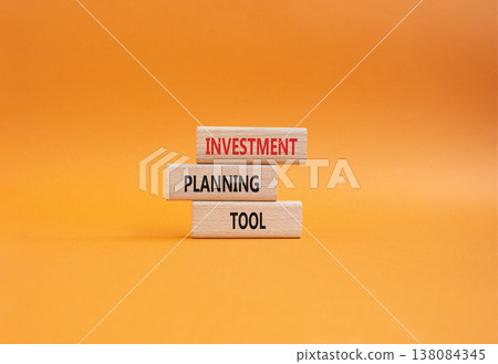 Investment planning tool symbol. Concept word Investment planning tool on wooden blocks. Beautiful orange background. Business and Investment planning tool. Copy space Investment planning tool symbol. Concept word Investment planning tool on wooden blocks. Beautiful orange background. Business and Investment planning tool. Copy space 138084345