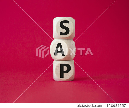 SAP - Systems Applications Products. Wooden cubes with word SAP. Beautiful red background. Business and System Application Product concept. Copy space. SAP - Systems Applications Products. Wooden cubes with word SAP. Beautiful red background. Business and System Application Product concept. Copy space. 138084367